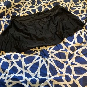 Black swim skirt bottom with left side slit. NWOT